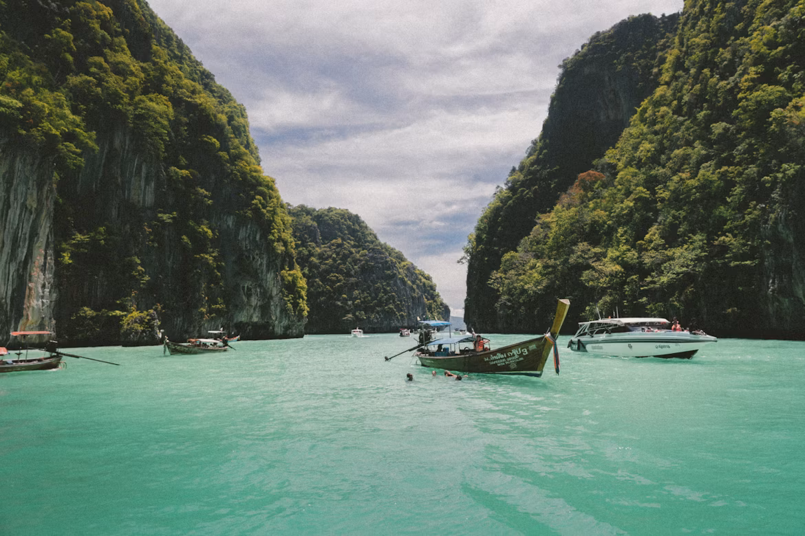 Golden temple and long-tail boats in Thailand